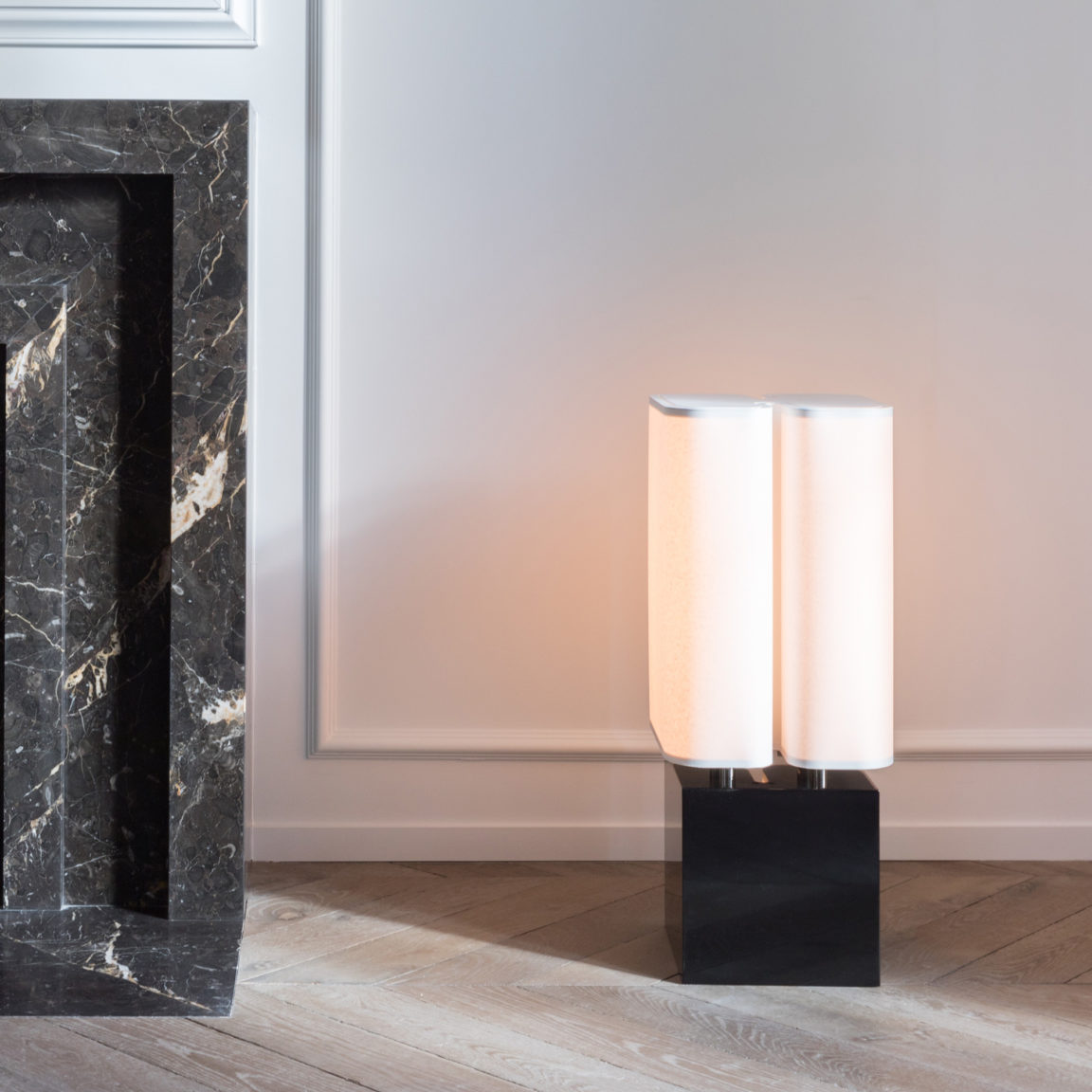Brasilia LH floor lamp by Michel Boyer placed on the floor of a Parisian apartment