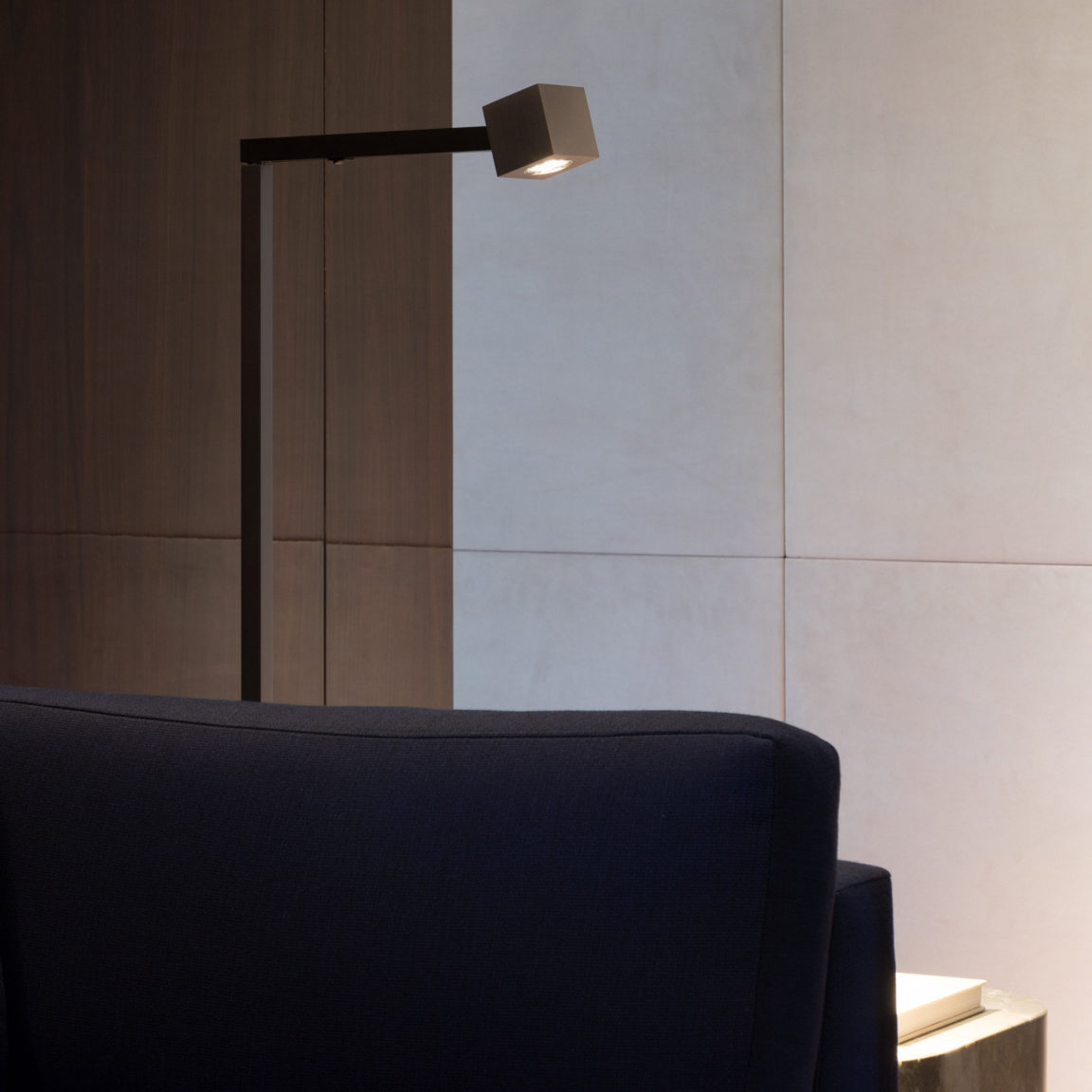 The Marienbad L floor lamp by Gounot & Jähnke illuminates a coffee table in a living room
