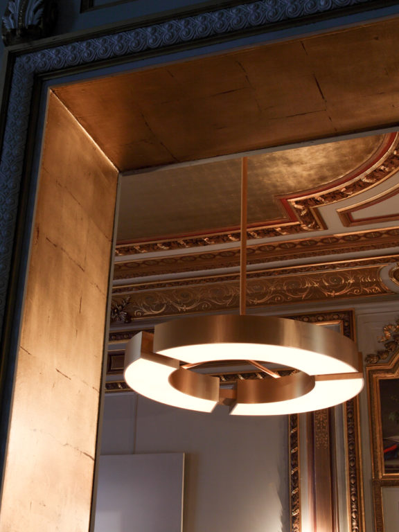 Classique V chandelier by Gounot & Jähnke with gold finish in a room with gilded decorations