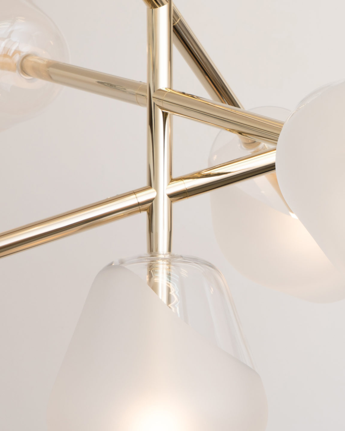 Focus on the pale gold finish of the Opéra chandelier by Régis Botta for Ozone