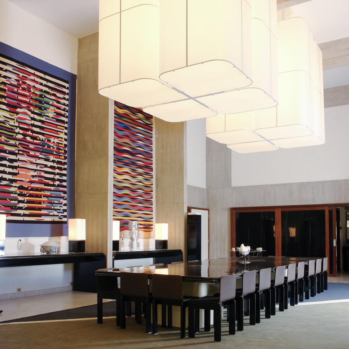 Image of the main hall of the French Embassy in Brazil with two large Brasilia L chandeliers and four Brasilia LP table lamps by Michel Boyer for Ozone