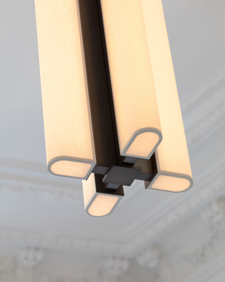 Avec ses quatre diffuseurs papier la suspension Tennessee S4 de Glenn Sestig illumine une pièce avec moulures au plafond