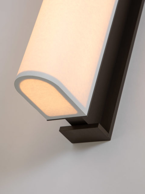 Focus on the white diffuser paper and matte bronze finish of Glenn Sestig's Tennessee WL sconce for Ozone