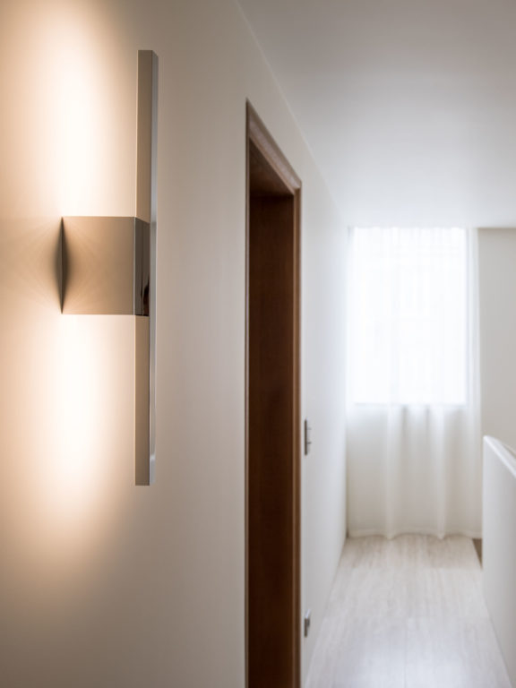 Untitled A sconce by Gounot & Jähnke in mirror nickel in a hallway