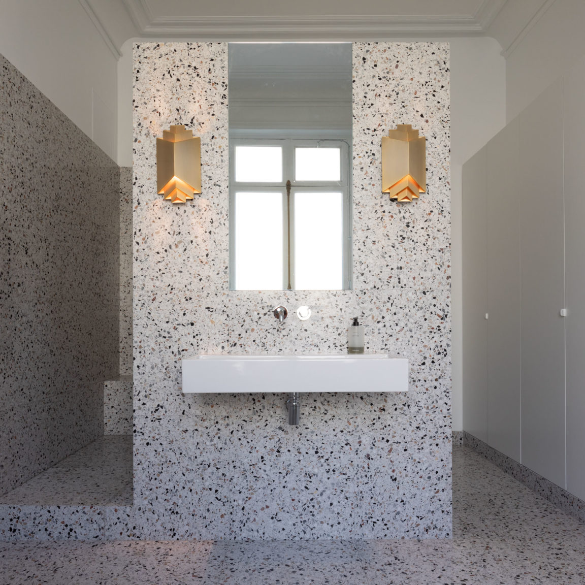 Two Phénix sconces designed by Joseph Dirand For Ozone in a bathroom