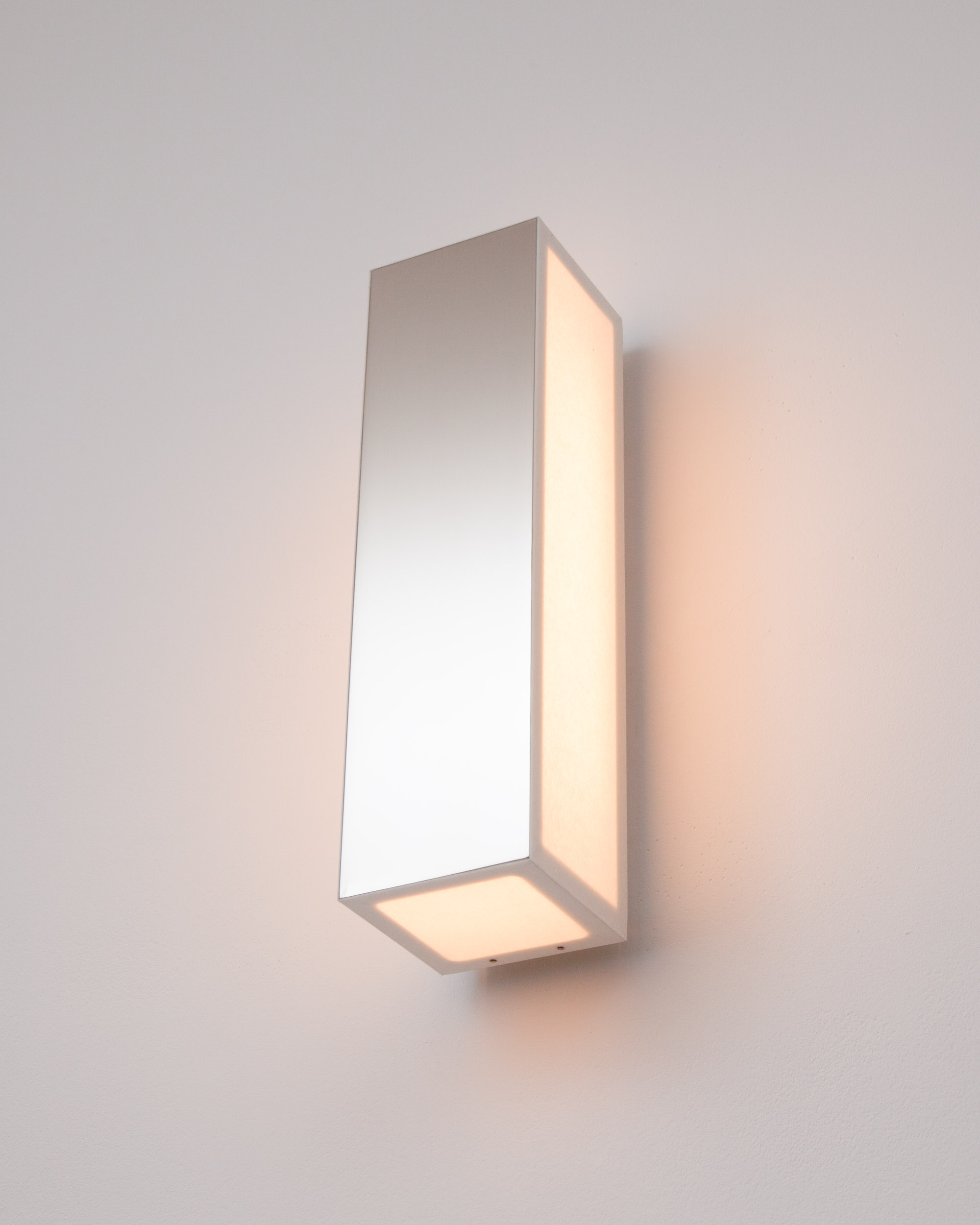 Line V sconce, featuring a mirror-polished nickel front and a paper diffuser, designed by Étienne Gounot and Éric Jähnke for Ozone