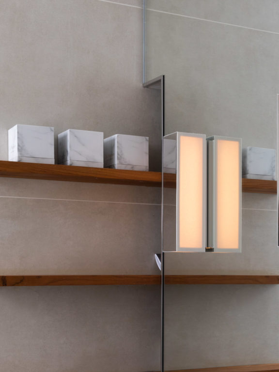 Line V wall light by Gounot & Jähnke for Ozone mounted on a mirror