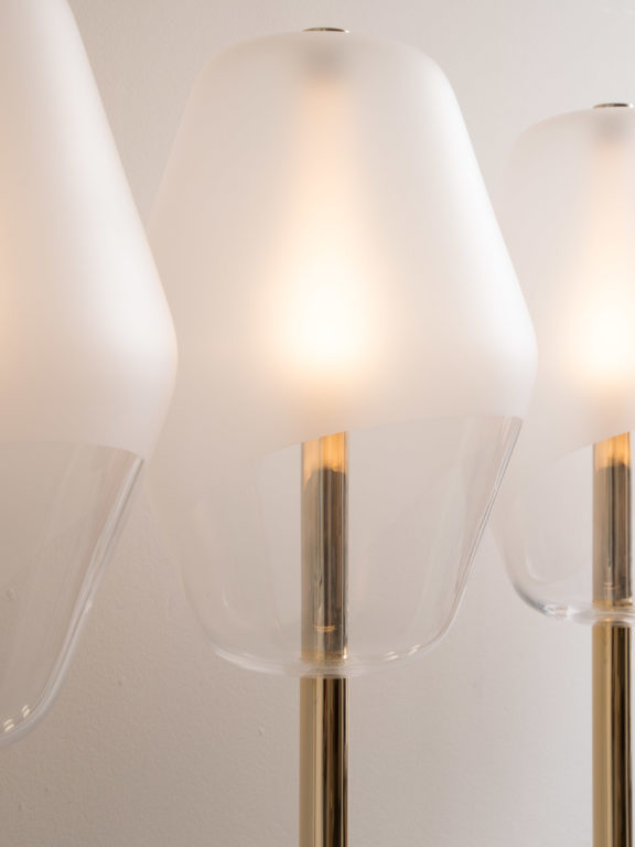 Focus on the partially sandblasted blown-glass globes of the Montmartre floor lamps, designed by Régis Botta for Ozone
