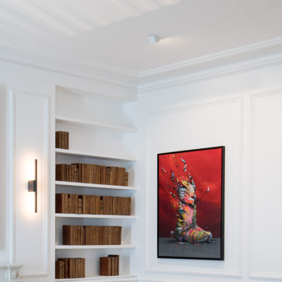 The Marienbad SW60 spotlight and the Untitled A sconce in a white library