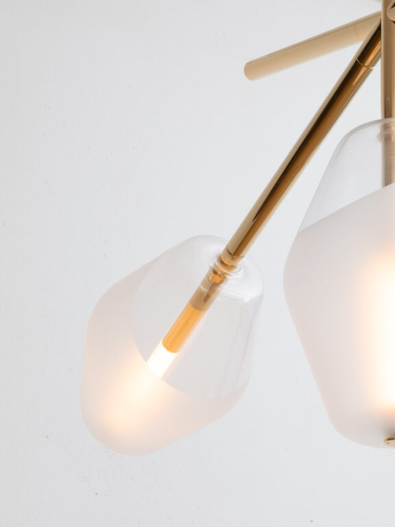 Focus on the pale gold finish and blown glass globe of the Concorde pendant lamp by Régis Botta for Ozone
