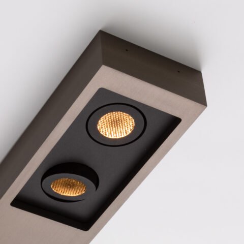 Focus on the matte bronze finish and the two spotlights of the Regard S ceiling light by Glenn Sestig