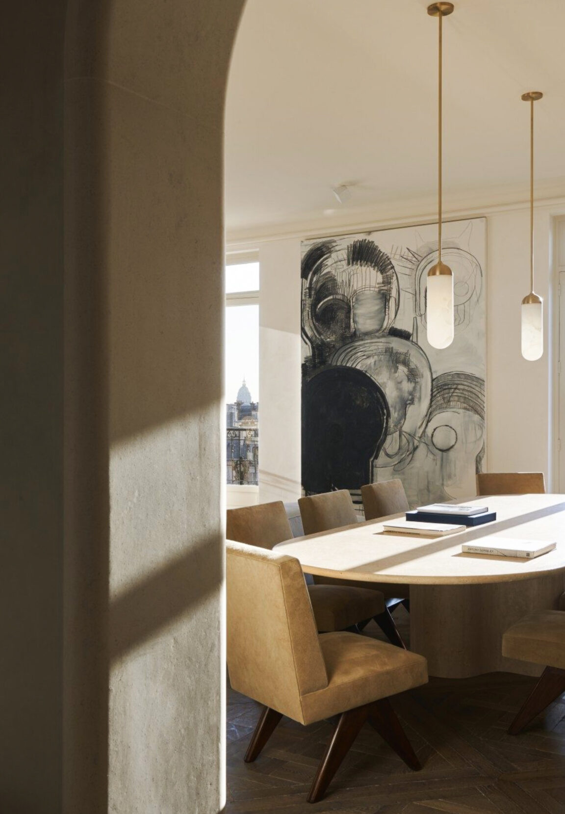 Two Gélule S pendant lights by Joseph Dirand for Ozone in a dining room