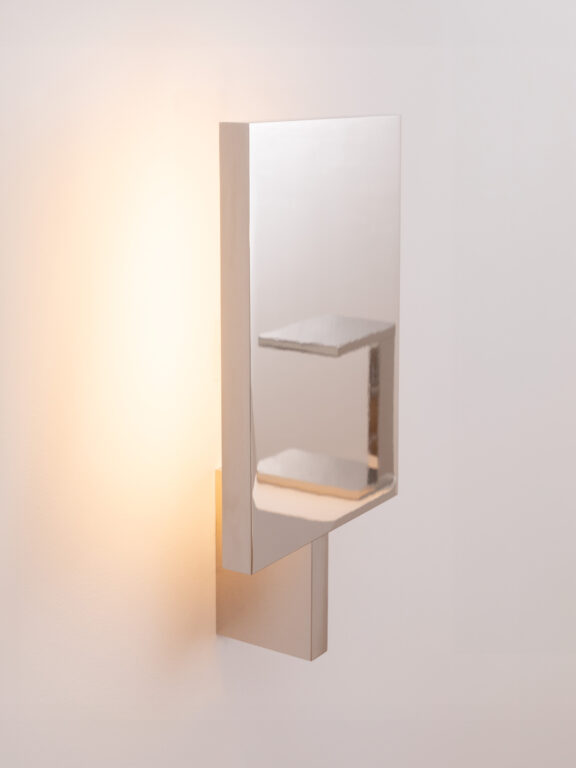 Reflection of the Furtiv LP table lamp on the mirrored nickel surface of the Furtiv A wall lamp by Lauriot-Prévost and Perrault for Ozone.
