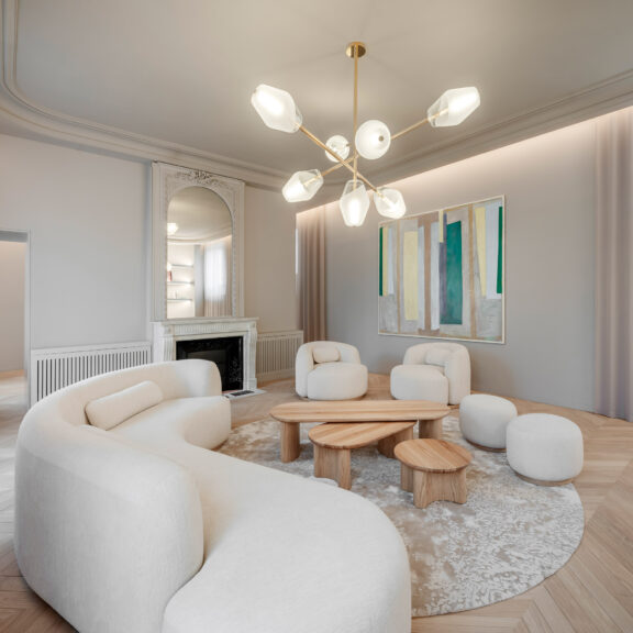 Régis Botta's Opéra chandelier illuminates a bright and modern living room.