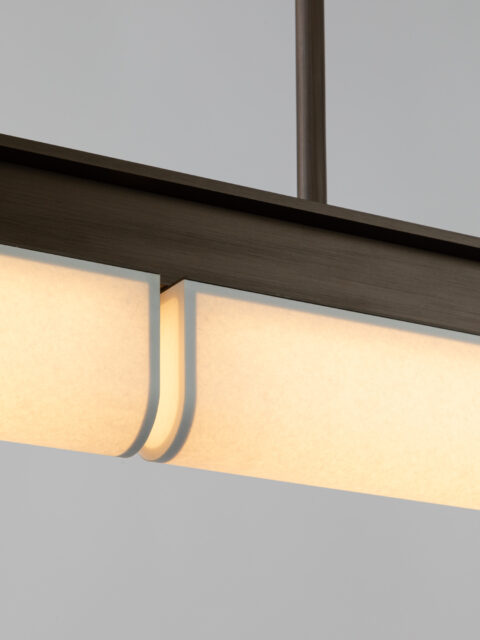 Focus on the white diffuser paper and matte bronze finish of Glenn Sestig's Tennessee PL2 pendant light for Ozone