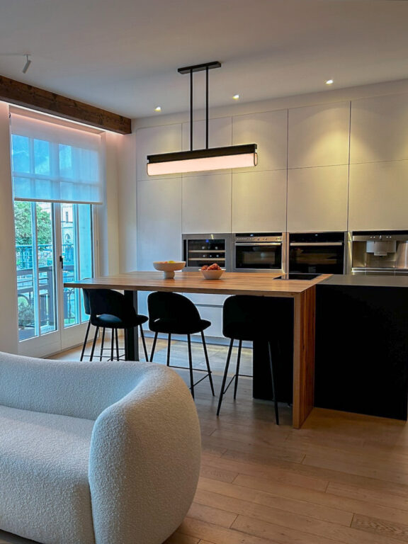 Glenn Sestig's Tennessee PL1 pendant light for Ozone illuminates a small modern kitchen