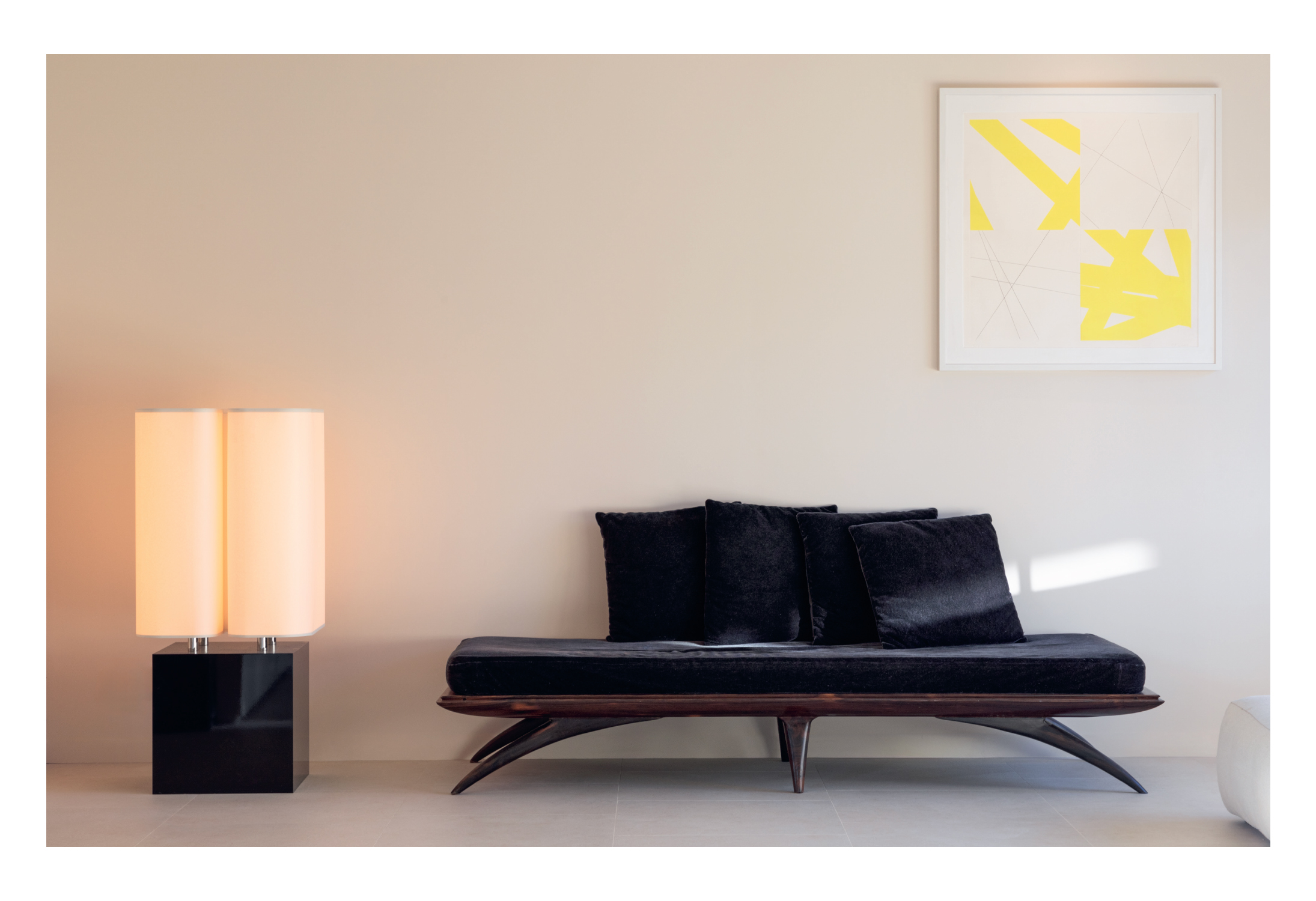 Double page spread from the Brasilia brochure showing a living room lit by the tall lamp from Ozone's Brasilia collection.
