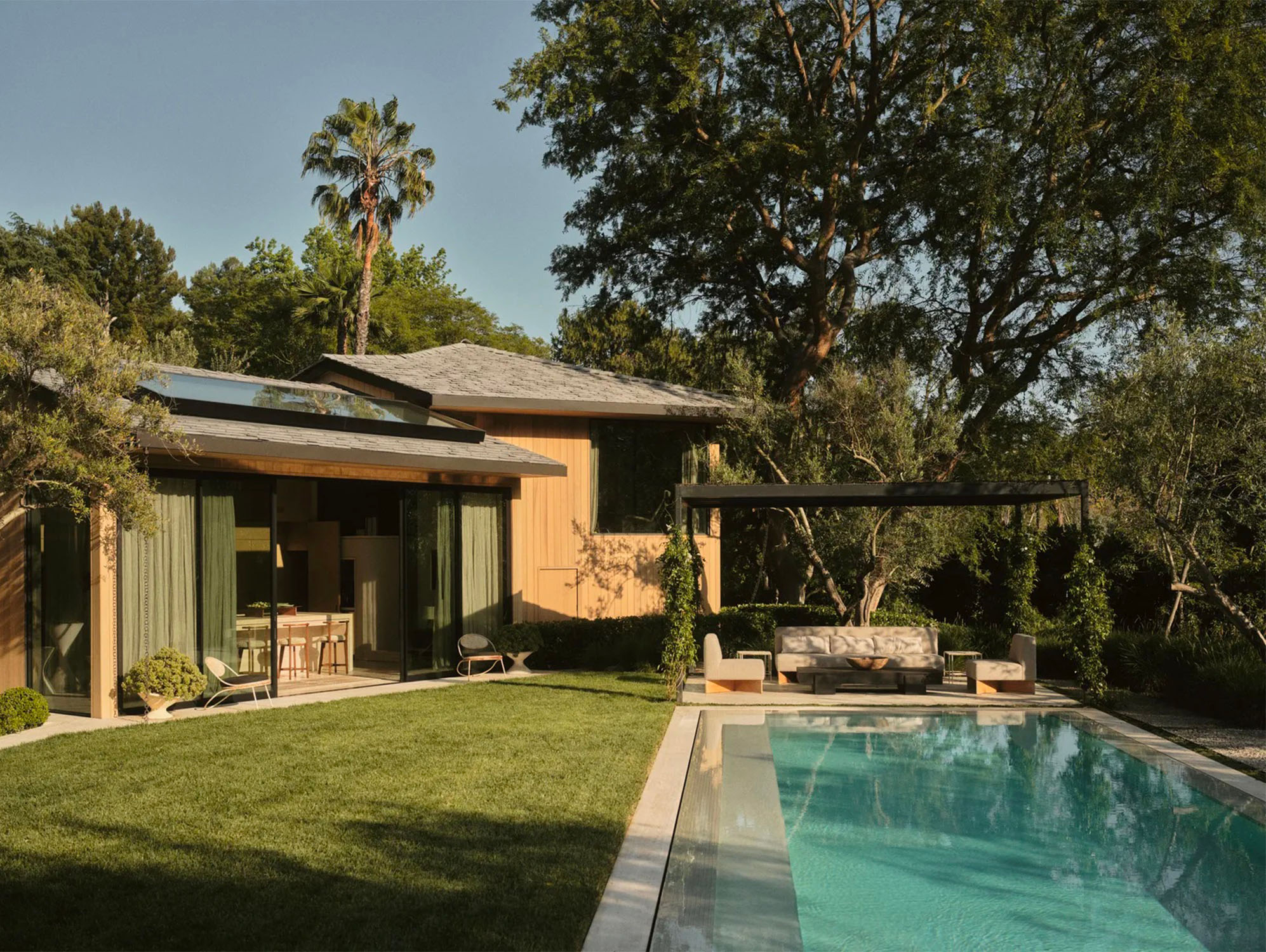 Outdoor garden with swimming pool at Jerry Lorenzo's house in Los Angeles