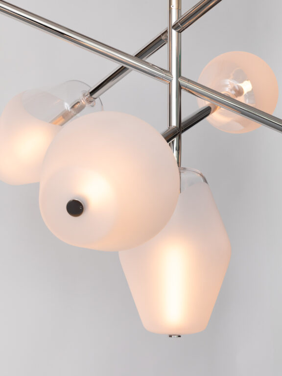 Close-up view of the Opéra chandelier in pale gold finish with blown glass globes from the Les Parisiennes collection by Régis Botta for Ozone