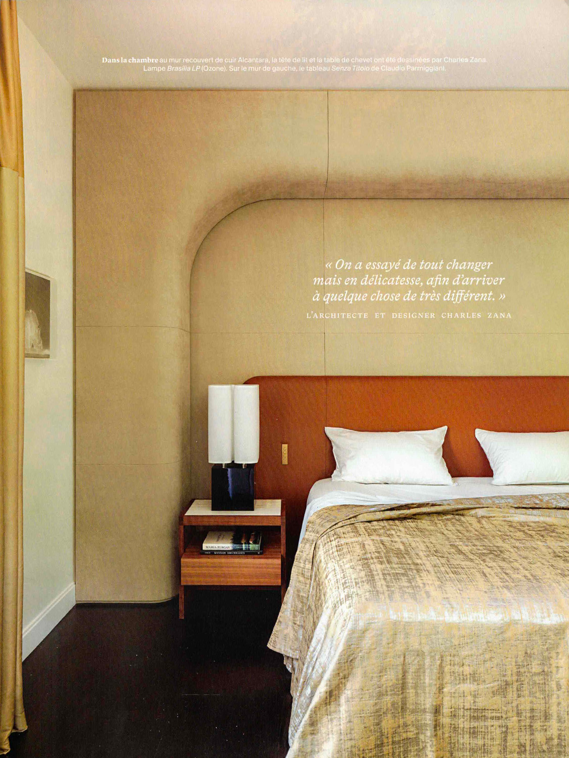 Page from AD magazine showing a bedroom with leather-covered walls and a bed featuring the Brasilia LP lamp designed by Michel Boyer for Ozone.