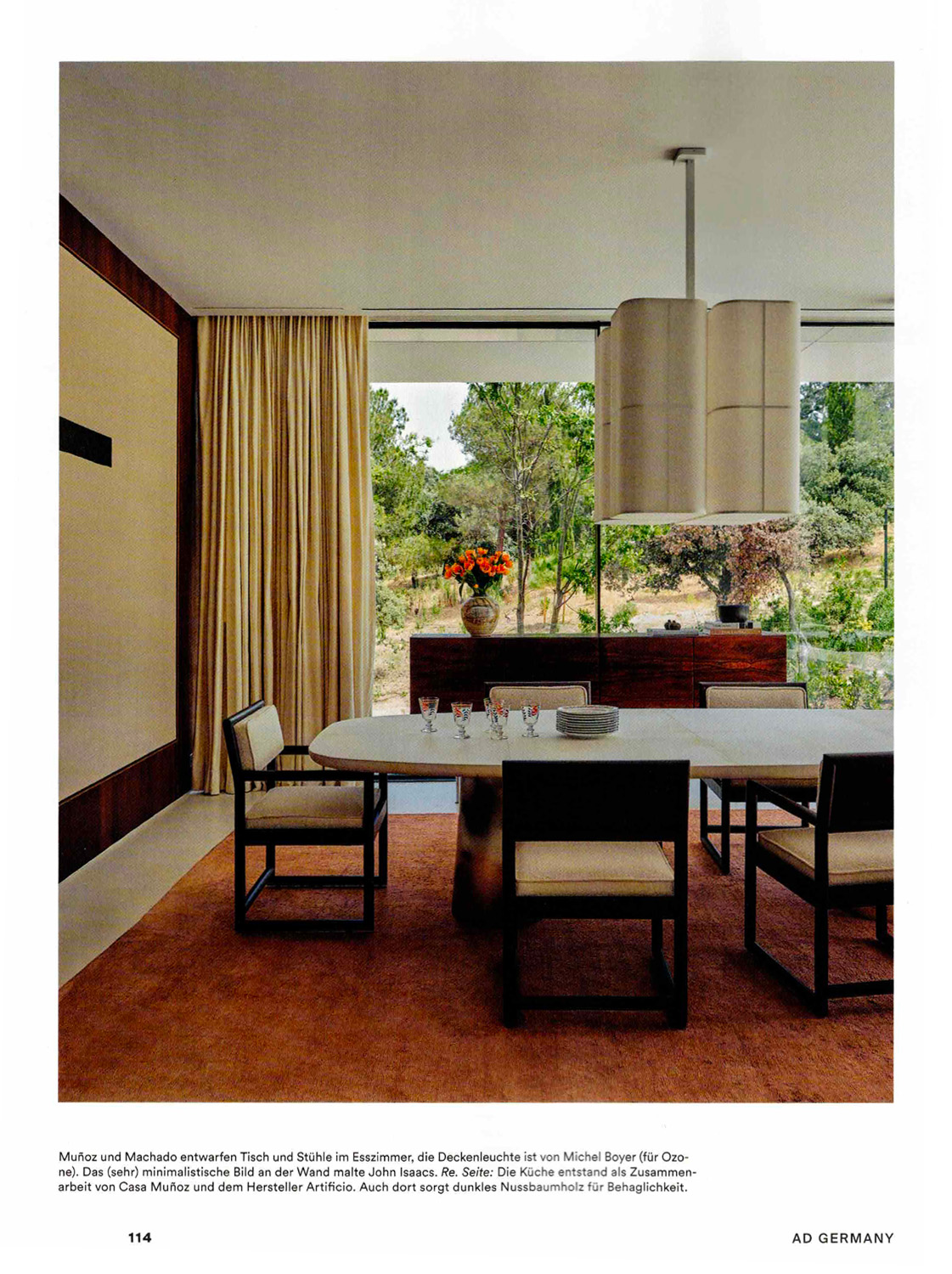 Page from the German magazine AD, December 2025, showing a dining room decorated with a Brasilia PL chandelier from the Brasilia collection created by Michel Boyer for Ozone.
