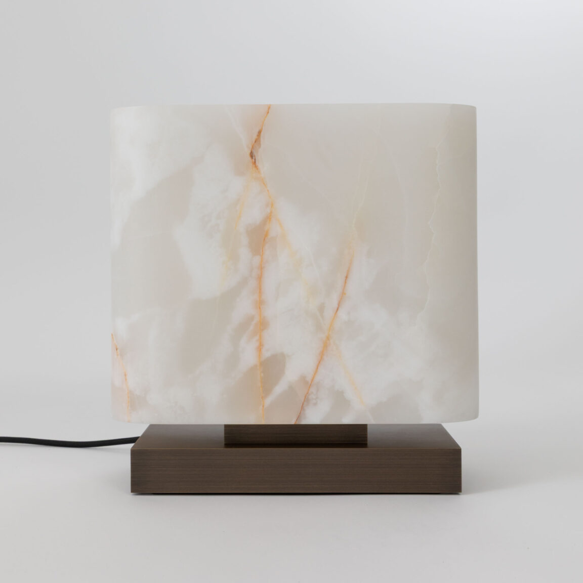 The Embrun LP table lamp in white onyx, unlit from the front