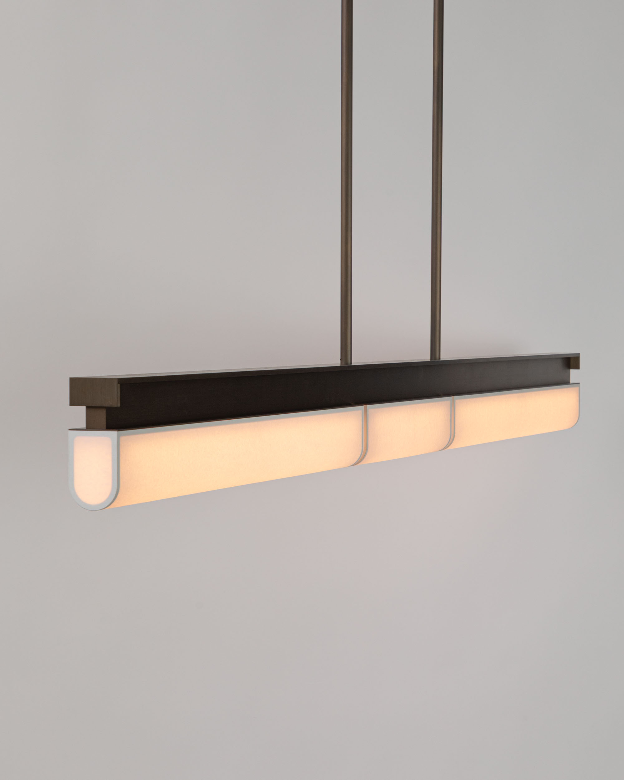 Studio photo of the Tennessee PL3 pendant lamp in matte bronze and white paper